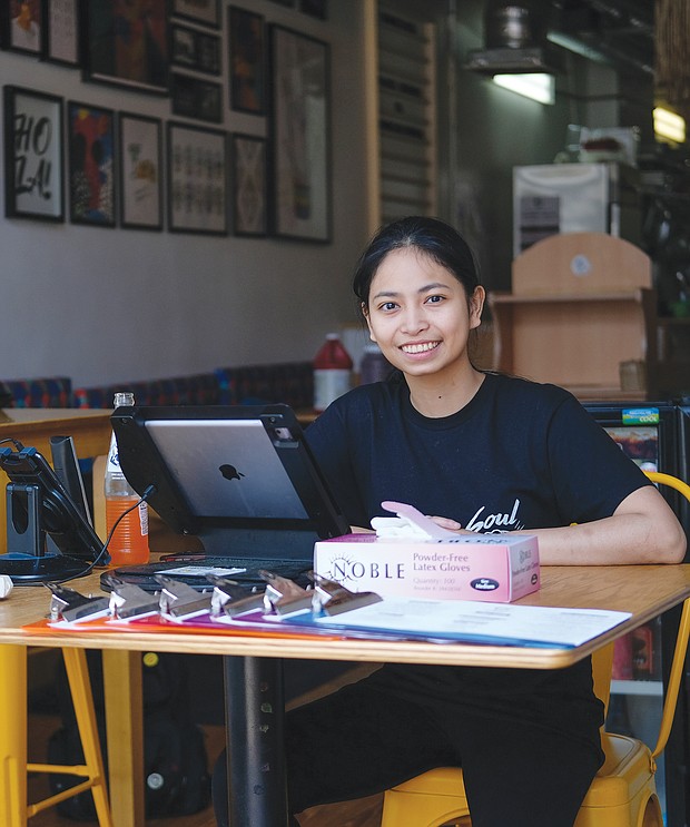 Czarina Deguzman sits in the doorway of Soul Taco to take to-go orders. The restaurant on 2nd Street is one of Soul Taco’s two locations in Downtown.