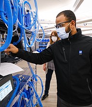 Workers build the first production ventilators at the General Motors manufacturing facility in Kokomo, Indiana, Tuesday, April 14, 2020. GM and Ventec Life Systems are partnering to produce VOCSN critical care ventilators in response to the COVID-19 pandemic. (Photo by AJ Mast for General Motors)