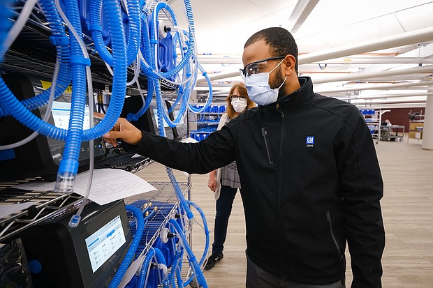 Workers build the first production ventilators at the General Motors manufacturing facility in Kokomo, Indiana, Tuesday, April 14, 2020. GM and Ventec Life Systems are partnering to produce VOCSN critical care ventilators in response to the COVID-19 pandemic. (Photo by AJ Mast for General Motors)
