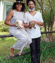 Nitika and Joshua Achalam may be staying home, but they are staying busy.
They are outside their home in Fulton with their chickens, Octavia Butler and Zora Neale Hurston.
Asked how their lives are different during the pandemic, Mrs. Achalam, executive director of Project Yoga Richmond and an herbal healer with True Grit Botanica, said, “We’ve launched an online membership platform where the community can remotely access yoga and mindfulness content from PYR ambassadors.”
Mr. Achalam, a reggae artist and educator, said, “Shows are postponed. But we’ll regroup and spend more time in the studio.”
On April 4, he performed in “Couchella,” a digital music festival that helped raise money for the Makindu Children’s Center in Kenya. The money will help install hand-washing stations at the center to combat the spread of COVID-19.
Asked about the silver lining, both say the crisis has caused them to slow down and concentrate on the health and well-being of themselves and family.