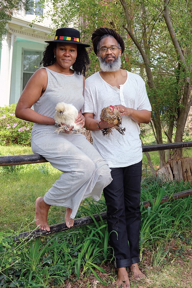 Nitika and Joshua Achalam may be staying home, but they are staying busy.
They are outside their home in Fulton with their chickens, Octavia Butler and Zora Neale Hurston.
Asked how their lives are different during the pandemic, Mrs. Achalam, executive director of Project Yoga Richmond and an herbal healer with True Grit Botanica, said, “We’ve launched an online membership platform where the community can remotely access yoga and mindfulness content from PYR ambassadors.”
Mr. Achalam, a reggae artist and educator, said, “Shows are postponed. But we’ll regroup and spend more time in the studio.”
On April 4, he performed in “Couchella,” a digital music festival that helped raise money for the Makindu Children’s Center in Kenya. The money will help install hand-washing stations at the center to combat the spread of COVID-19.
Asked about the silver lining, both say the crisis has caused them to slow down and concentrate on the health and well-being of themselves and family.