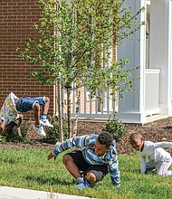 Montrell Mosley, 6, left, keeps the backflip and cartwheel party going as Demario Otey, 9, and Aiden Otey, 5, finish their rotations last Saturday in the 1700 block of Armstrong Way in Church Hill North.