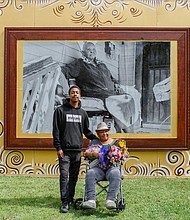 Longtime community advocate Cleola Williams pictured with mural artist Colby Deal