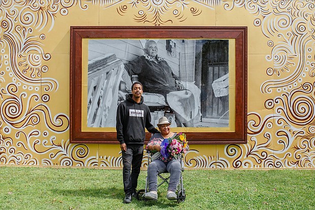 Longtime community advocate Cleola Williams pictured with mural artist Colby Deal