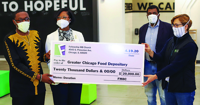 The Rev. Reginald W. Sharpe, Jr., pastor of Fellowship Missionary Baptist Church, and Kate Maehr, executive director and CEO of the Greater Chicago Food Depository, at the check presentation. Photos courtesy of Fellowship Missionary