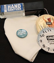 At the Hillside Court testing site, participants received COVID-19 kits that containing a face mask, hand sanitizer, a reminder lapel button and condoms.