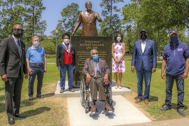 Participants in the late Congressman Mickey Leland statue unveiling at Hermann Park on Saturday, April 25 pose in front of statue. Left to right: Rev. James Dixon, head of Community of Faith Church; J. Kent “Kenny” Friedman, General Counsel and Chief Administrative Officer at Morae Global Corp.; Congresswoman Sheila Jackson Lee; the Rev. William “Bill” Lawson; Alison Leland, Congressman Mickey Leland’s widow; Harris County Commissioner Rodney Ellis; and Mayor Sylvester Turner.