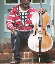 Paul Rucker, a visual artist, musician and composer, sits with his cello on the steps of his home in Downtown. He is an iCubed Arts Research Fellow at Virginia Commonwealth University. The pandemic, he said, “offers those, especially with privilege, a time for reflection. I think this is an opportunity to evaluate and move in new directions. This is not a time for fear.”