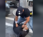 NYPD Officer Francisco Garcia attacks bystander