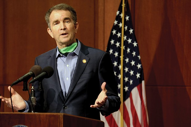 Gov. Ralph S. Northam notes that COVID-19 invaded the state two months ago as he updates reporters on the plan for reopening businesses at a news conference Wednesday. He also saluted nurses in honor of National Nurses Day and praised the soldiers in the Virginia National Guard for their work to combat the disease.