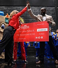 Booker T. Washington High School Principal Carlos Phillips received a $10,000 cash prize and a $25,000 grant for Washington High School