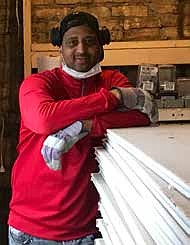 Keith Lindsey, founder and CEO of Solar Energy Construction, inside the Englewood building that he’s rehabbing and converting into discounted housing for veterans. Lindsey acquired the building from the Cook County Land Bank Authority. Photo provided.
