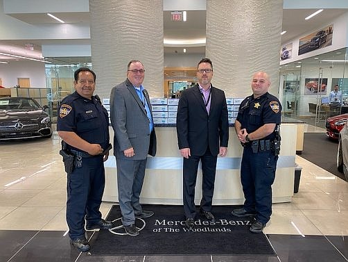 (From left) Deputy Carlos Tavarez, Captain Tim Holifield, Fred Gallucci, Sales Manager at Mercedes-Benz of the Woodlands and Deputy Eric Medina picking up 10,000 FDA approved masks to utilize in the community.