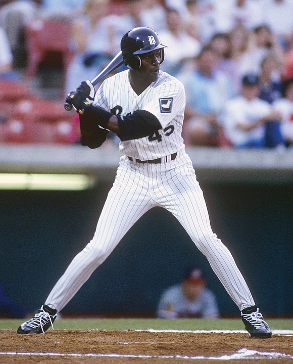 Michael Jordan of the Birmingham Barons stands with a Little League News  Photo - Getty Images