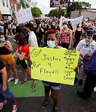 A sea of protesters gather at the site in Minneapolis where a white police officer intentionally kneeled on the neck of George Floyd. Mr. Floyd later was pronounced dead at a nearby hospital.