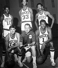 Milwaukee Bucks 1970-71 starting lineup: Standing, left to right, Richmonder Bobby Dandridge, Lew Alcindor before he changed his name to Kareem Abdul-Jabbar, and Greg Smith. Kneeling, left to right, Jon McGlocklin, Coach Larry Costello and Oscar Robertson.