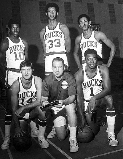 Milwaukee Bucks 1970-71 starting lineup: Standing, left to right, Richmonder Bobby Dandridge, Lew Alcindor before he changed his name to Kareem Abdul-Jabbar, and Greg Smith. Kneeling, left to right, Jon McGlocklin, Coach Larry Costello and Oscar Robertson.