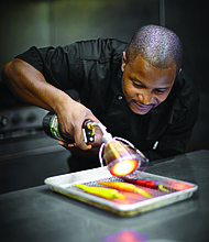 Chef D’Andre Carter opened Soul & Smoke in 2013 in Evanston. Since COVID-19 struck, he has not laid off any employees. Photo courtesy of D’Andre Carter