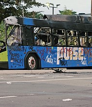 The burned out hulk of a GRTC Pulse bus was still at Belvidere and Broad streets as the sun rose — one of the most visible signs of the violence that took over the protest Friday night.