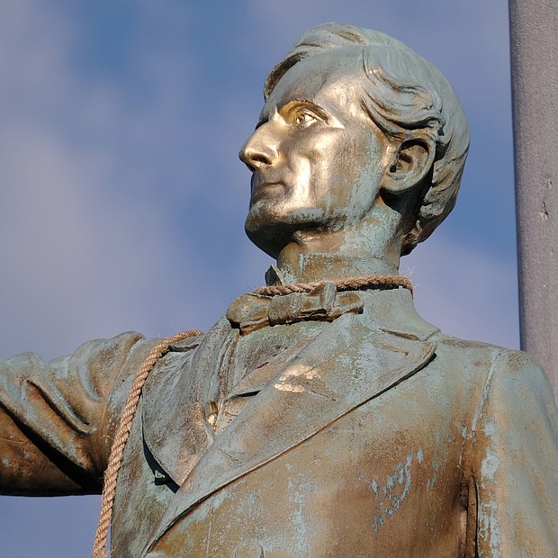 The statue of Confederate President Jefferson Davis sports a noose, the remnant of a rope someone unsuccessfully sought to use to pull down the statue.