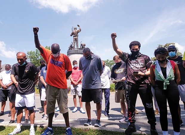 Coaches representing at least 100 schools and various sports participate during last Saturday’s rally and march that started at the statue of tennis great Arthur Ashe Jr. and proceeded down Monument Avenue to the Lee statue. The coaches want to be a voice for change for area youths.