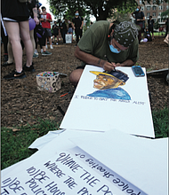 Artist Barabbas Rowland II draws a portrait of Marcus-David Peters, a 24-year-old biology teacher who was experiencing a mental crisis when he attacked and was fatally shot by a Richmond Police officer in May 2018.
