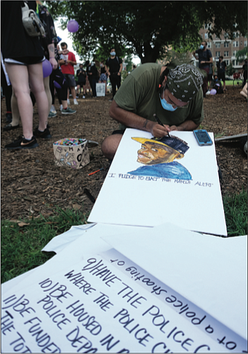 Artist Barabbas Rowland II draws a portrait of Marcus-David Peters, a 24-year-old biology teacher who was experiencing a mental crisis when he attacked and was fatally shot by a Richmond Police officer in May 2018.