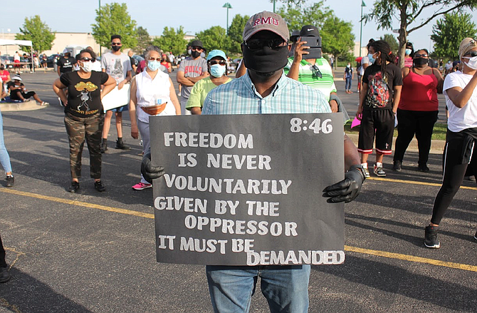 More than 1,000 people attended a June 8, 2020 Black Lives Matter rally in south suburban Matteson to protest the death of George Floyd, an unarmed black man, who recently died after a white Minneapolis police officer allegedly held his knee on Floyd’s neck until he could not breathe for nearly nine minutes. Photo credit: Wendell Hutson