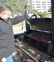 Making sure grill grates and food preparation surfaces are clean are essential steps in lowering the risk of foodborne illness when grilling. (Texas A&M AgriLife Extension Service photo )