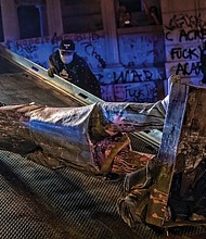 View of toppled statue of Confederate President Jefferson Davis that was pulled off its perch on Monument Avenue on June 10. A tow truck was called to lift and carry the statue away. This is one of four symbols of white supremacy and oppression that have been toppled in the city since demonstrations began on May 29.