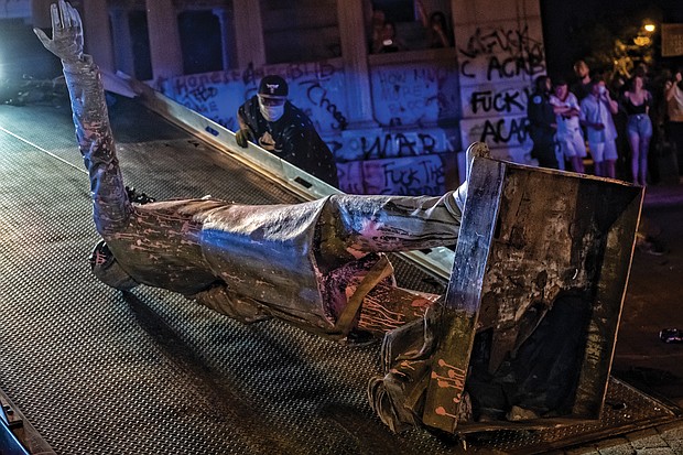 View of toppled statue of Confederate President Jefferson Davis that was pulled off its perch on Monument Avenue on June 10. A tow truck was called to lift and carry the statue away. This is one of four symbols of white supremacy and oppression that have been toppled in the city since demonstrations began on May 29.