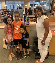 Author and social media professor Angela Marie Hutchinson with her three kids. PHOTO COURTESY ANGELA MARIE HUTCHINSON