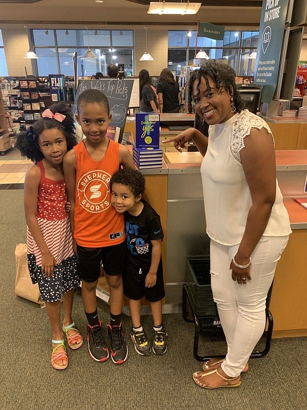 Author and social media professor Angela Marie Hutchinson with her three kids. PHOTO COURTESY ANGELA MARIE HUTCHINSON