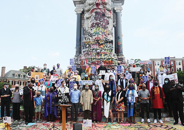 More than 40 faith leaders from a variety of faith traditions call for an end to police violence against those protesting racial injustice during a news conference Tuesday at the base of the Lee statue on Monument Avenue. Protesters renamed the area Marcus-David Peters Circle to bring attention to the 2018 death of the 24-year-old biology teacher who was shot and killed by a Richmond Police officer during what has been described as a mental crisis.