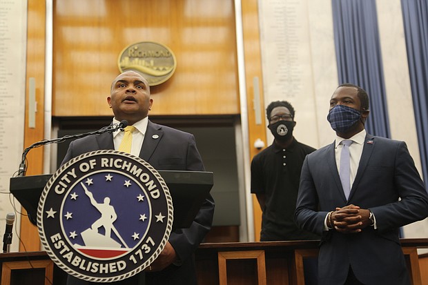 “I’m listening,” new Richmond Police Chief Gerald M. Smith says at a City Hall press conference Saturday after Mayor Levar M. Stoney, right, introduced him. “My office, my phone line, my email is open to you, so let’s have a conversation.” The city’s 20th chief began work Wednesday.