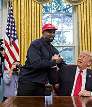 Rapper Kanye West, left, shakes hands with U.S. President Donald Trump during a meeting in the Oval Office of the White House in Washington, D.C., U.S., on Thursday, Oct. 11, 2018. West, a recording artist and prominent Trump supporter, is at the White House to have lunch with the president and to meet with presidential son-in-law and senior adviser Jared Kushner who has spearheaded the administrations efforts overhaul the criminal justice system. Photographer: Andrew Harrer/Bloomberg via Getty Images
Credit:	Bloomberg/Bloomberg/Bloomberg via Getty Images