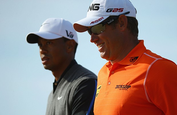 Lee Westwood (right) says the despite the "best player" in golf --Tiger Woods (left) -- being Black, golf can do more to promote the game with non-White players./Credit:	Matthew Lewis/Getty Images Europe/Getty Images