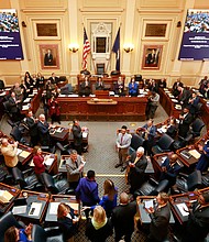 Virginia House of Delegates, Speaker Eileen Filler-Corn, D-Fairfax, center, is escorted to the rostrum during opening ceremonies of the 2020 Virginia General Assembly at the Capitol in Richmond, Virginia, in January 2020. Filler-Corn is the first woman to hold the position./Credit:	Steve Helber/AP