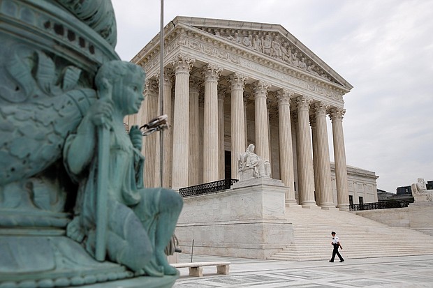A police officer walks outside the Supreme Court on Capitol Hill in Washington, Monday, July 6, 2020./Credit:	Patrick Semansky/AP