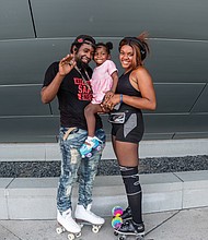 Autumn Bell, 2, takes a brief break from skating to relax with her mom and dad. The youngster was with her parents, DeMarius Thomas and Brinnay Bell, on July Fourth outside Virginia Commonwealth University’s Institute for Contemporary Art in Downtown.