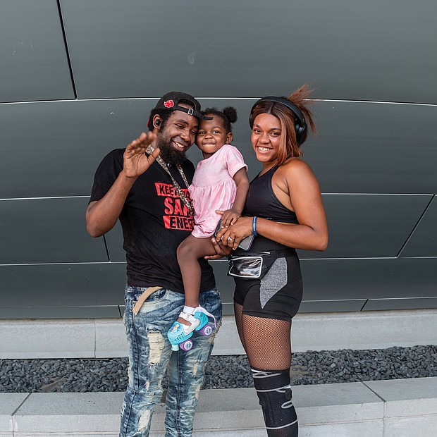 Autumn Bell, 2, takes a brief break from skating to relax with her mom and dad. The youngster was with her parents, DeMarius Thomas and Brinnay Bell, on July Fourth outside Virginia Commonwealth University’s Institute for Contemporary Art in Downtown.