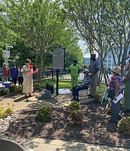Betty Squire, president of Engine Company No. 9 & Associates, leads a ceremony marking the 70th anniversary of the hiring of the first African- American firefighters by the City of Richmond on July 1, 1950. The ceremony was held Sunday by the historical marker at 5th and Duval streets near the site of the engine company’s station. The city integrated the fire department on July 6, 1963, and demolished the station in 1968. About 40 people attended the event, including relatives of the trailblazing firefighters.