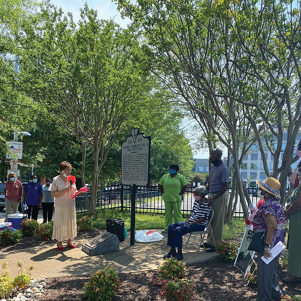 Betty Squire, president of Engine Company No. 9 & Associates, leads a ceremony marking the 70th anniversary of the hiring of the first African- American firefighters by the City of Richmond on July 1, 1950. The ceremony was held Sunday by the historical marker at 5th and Duval streets near the site of the engine company’s station. The city integrated the fire department on July 6, 1963, and demolished the station in 1968. About 40 people attended the event, including relatives of the trailblazing firefighters.