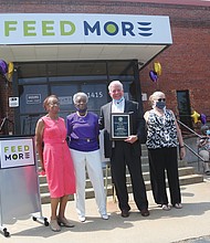 Members of the Delver Woman’s Club of Richmond celebrate the group’s 75th anniversary through its Legacy Community Service Project – a contribution of $5,685 to Feed More, Central Virginia’s primary hunger relief organization. The ceremony, held June 30 outside Feed More’s North Side headquarters, featured a musical prelude by the Jason Jenkins Quartet. The women’s club, which traces its early roots to a literary club for African-American women, was officially started in 1945 and has dedicated itself to civic engagement and service. The club’s 75th anniversary theme: “The Past, The Present, The Future: Continued Commitment to the Community.” In 1967, the club was among the founding members of Meals on Wheels, a program that delivers meals to seniors in their homes and which now comes under Feed More’s umbrella of agencies. The gift to Feed More by the Delver Woman’s Club’s 70 members, their families and friends will provide 22,740 meals to people in the Richmond area. Participating in the program are, from left, Jean T. Williams, legacy project chair; Theo S. Jones, immediate past president; Douglas H. Pick, Feed More’s president and chief executive officer; and Kathryn Erhardt, Feed More’s manager of planned and leadership giving.