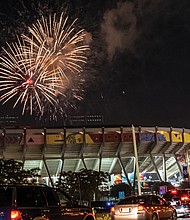Traffic stops along Arthur Ashe Boulevard last Saturday as drivers and their passengers watch the Fourth of July fireworks display over The Diamond.