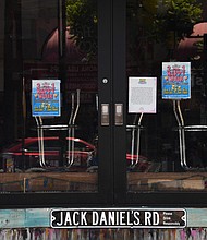 Stools sit upside down on a counter at a closed bar in Hollywood, California./Credit:	Robyn Beck/AFP/Getty Images