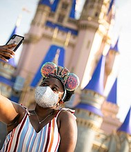 The new uniform for Disney visitors is mouse ears and a mask./Credit:	Walt Disney World Resort/Getty Images