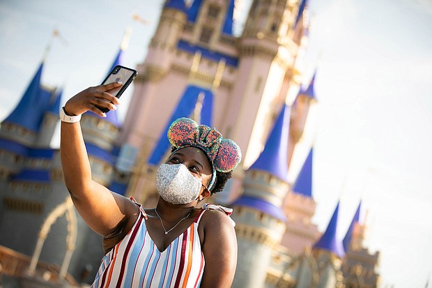 The new uniform for Disney visitors is mouse ears and a mask./Credit: Walt Disney World Resort/Getty Images