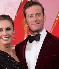 Elizabeth Chambers and Armie Hammer arrive at the Oscars in March 2018 in Los Angeles. The pair have announced they are separating after 10 years of marriage./Credit:	Richard Shotwell/Invision/AP