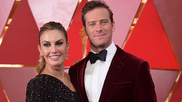 Elizabeth Chambers and Armie Hammer arrive at the Oscars in March 2018 in Los Angeles. The pair have announced they are separating after 10 years of marriage./Credit:	Richard Shotwell/Invision/AP